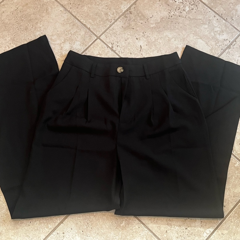Black slacks size M. Never worn.